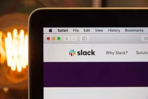 Slack web open on Apple MacBook laptop